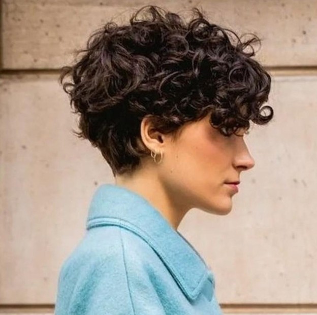 Woman with a curly pixie cut
